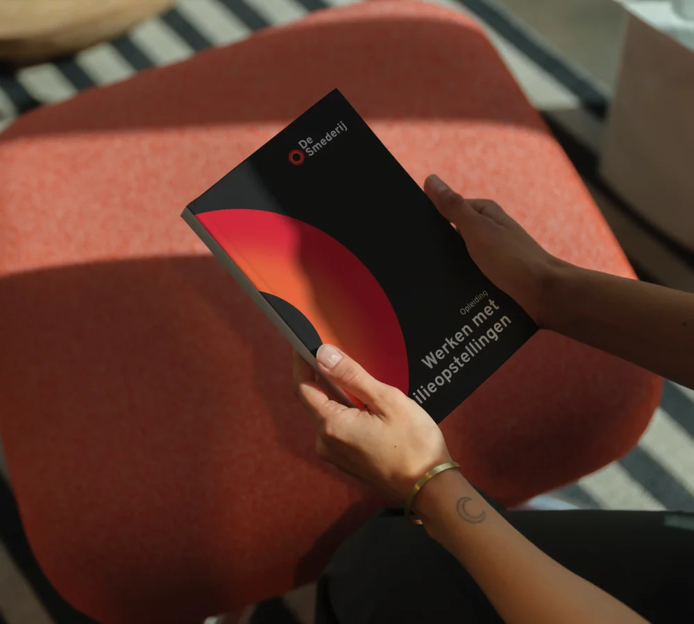 mockuuups-c-format-book-mockup-in-hands-on-a-modern-stool